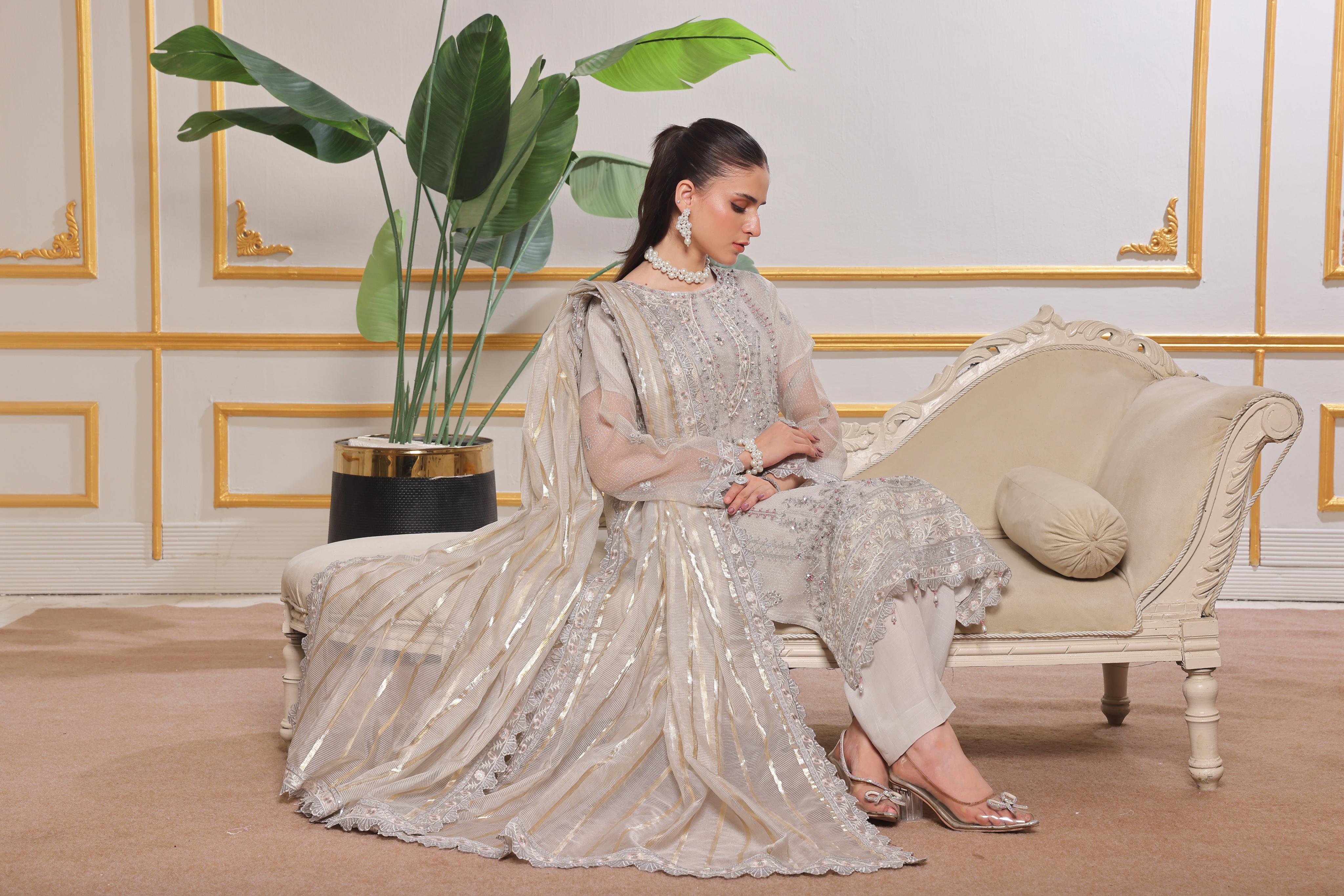 Dressline Red-Rose A Statement Of Elegance Semi Stitched Zari Aiyudiya Net Collection With Staple Lorex Dhari Dupatta & Raw Silk Grip Trousers
