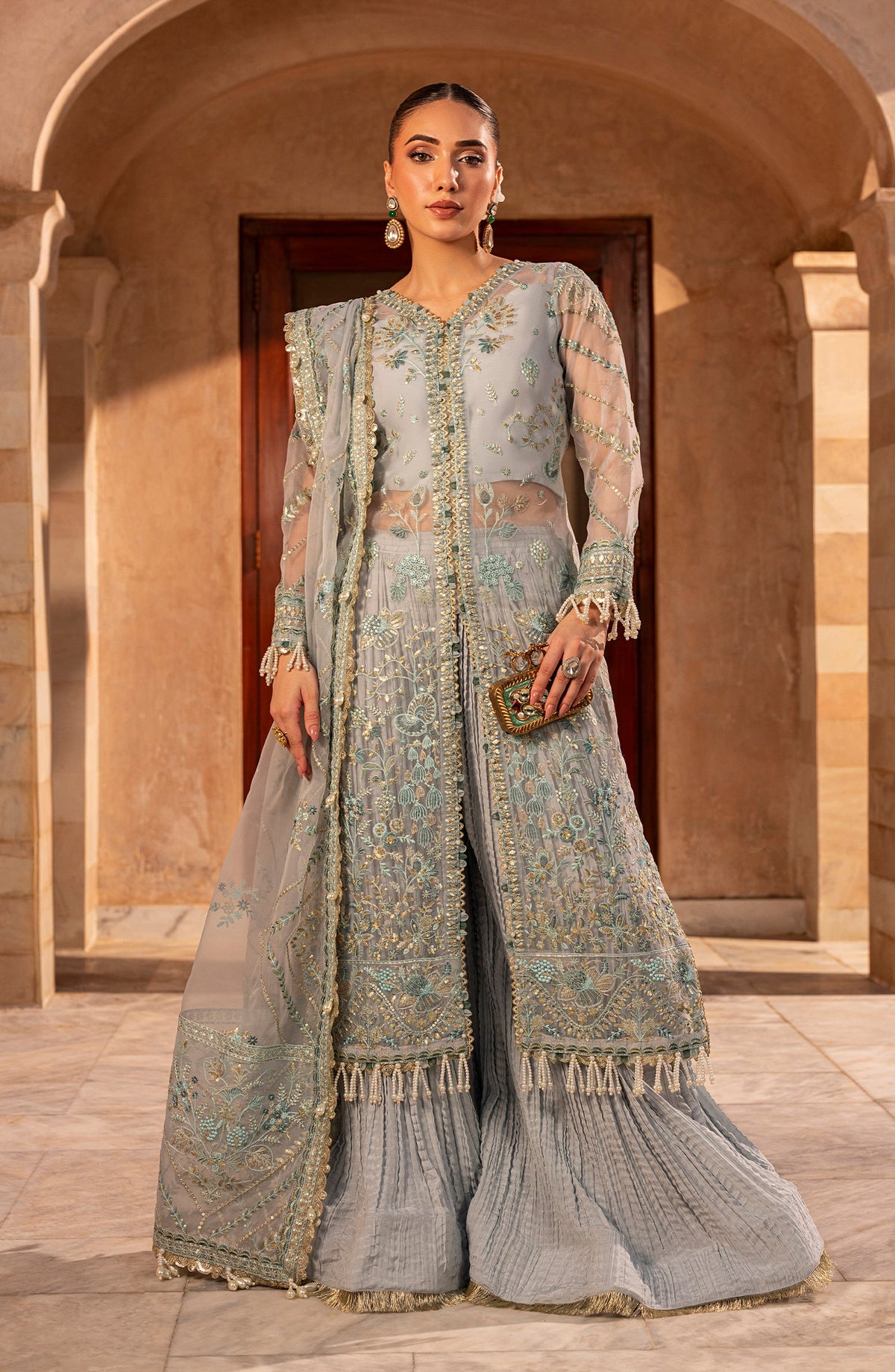 Model front look wearing Aylin Aqua formal dress in soft aqua shade