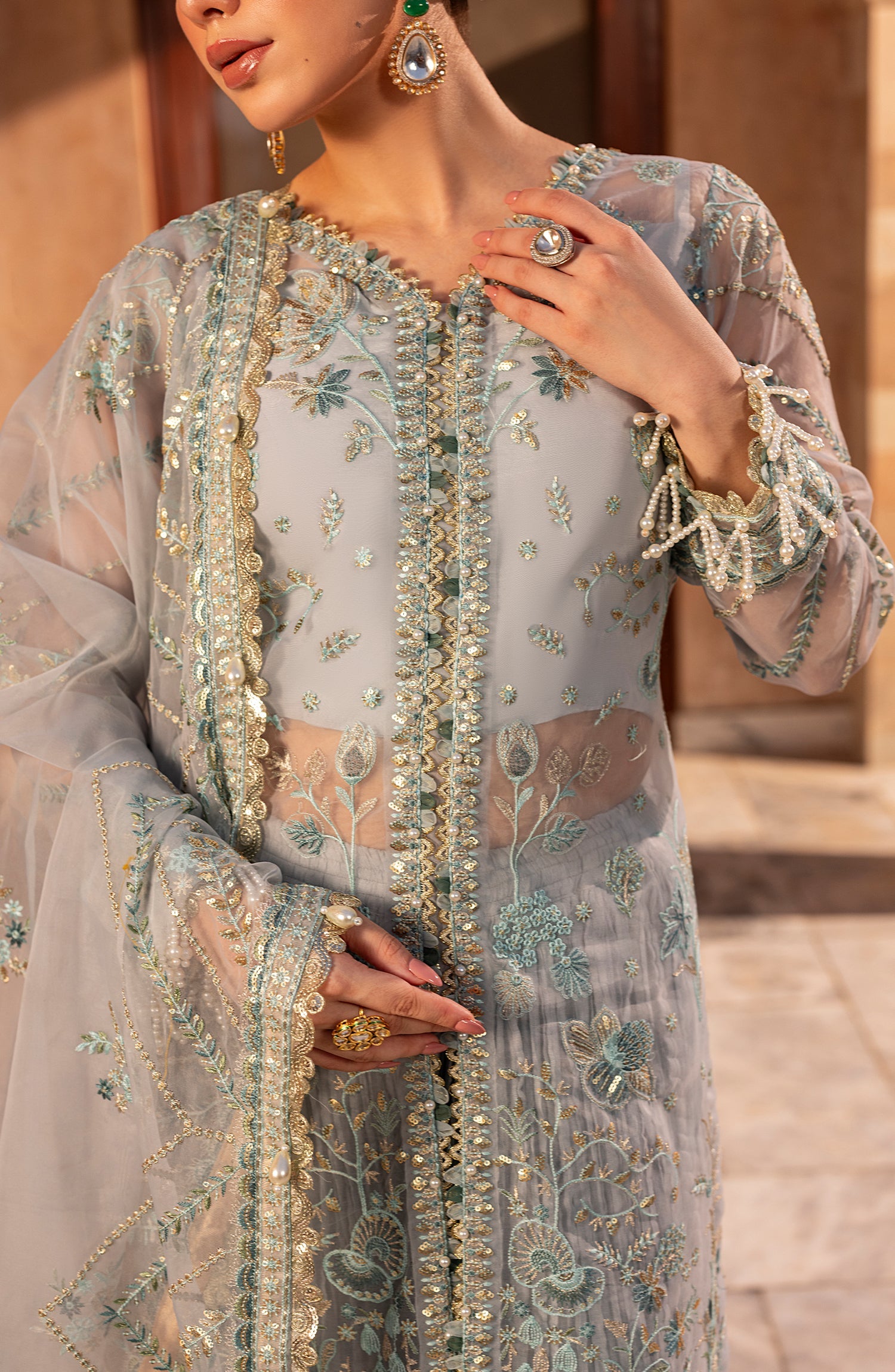 Close-up of model highlighting Neckline details of Aylin Aqua formal dress