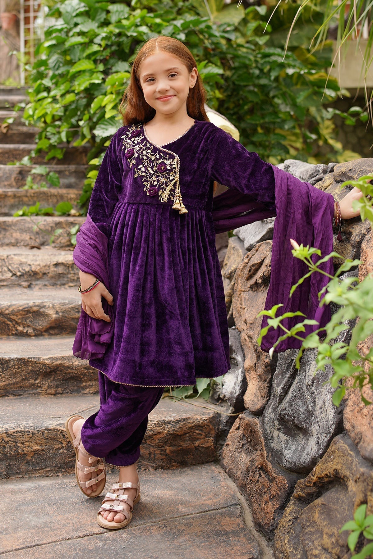 Indulge in the luxurious Velvet Hand Adda Work 3-Pc Suit, designed for elegance. Its exquisite craftsmanship and rich fabric make it perfect for any special occasion.